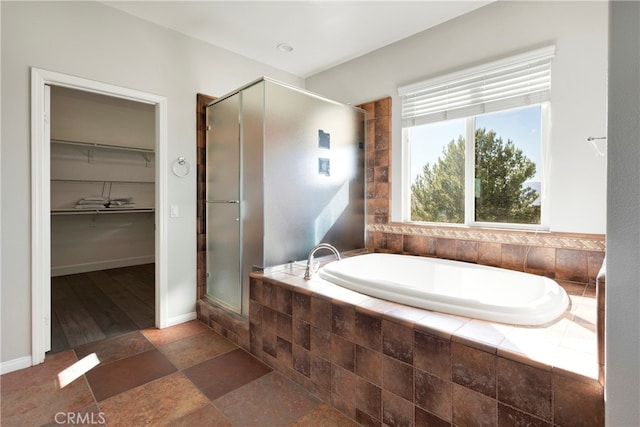 bathroom with separate shower and tub and hardwood / wood-style floors