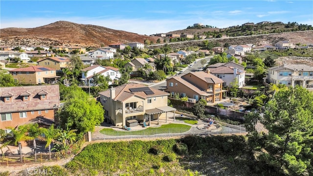 birds eye view of property featuring a mountain view