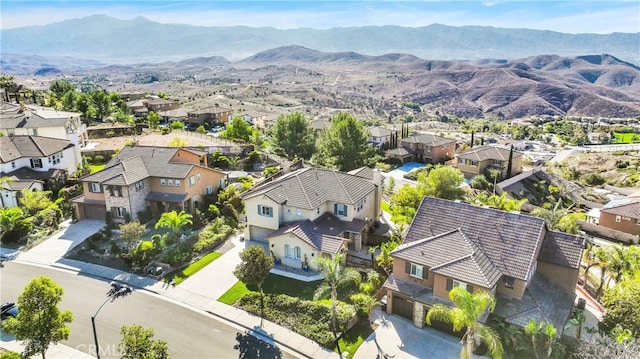 birds eye view of property with a mountain view