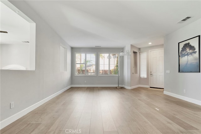 empty room with light wood-type flooring