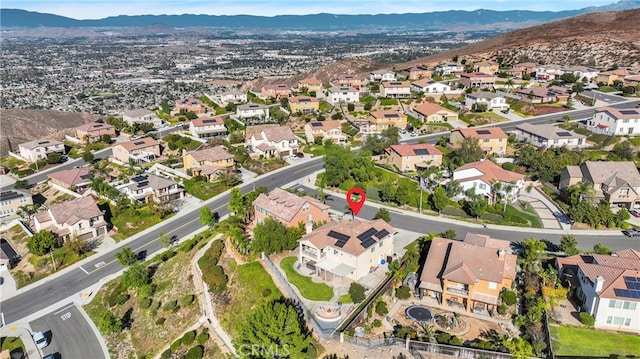 birds eye view of property with a mountain view