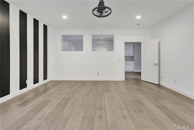 unfurnished room featuring light wood-type flooring