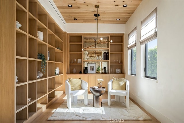 unfurnished room featuring wood ceiling and wood-type flooring