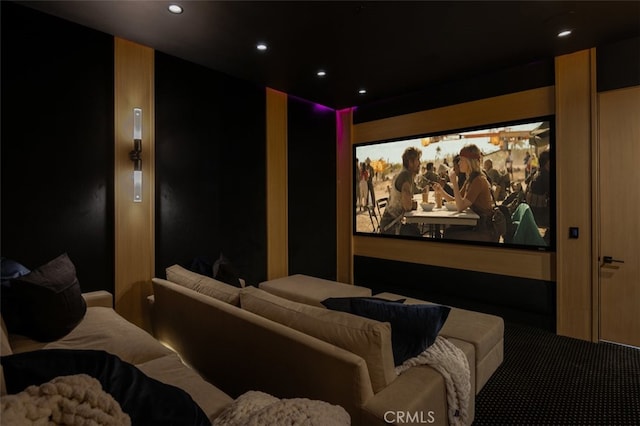 cinema room featuring carpet flooring