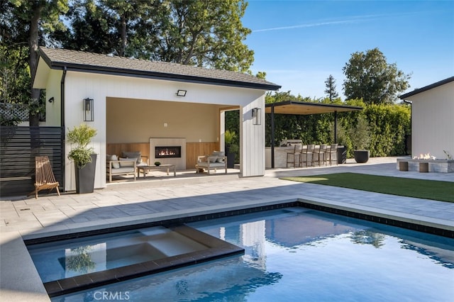 view of pool with an outdoor living space and a patio area