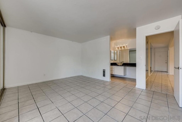 spare room featuring light tile patterned floors