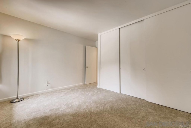 unfurnished bedroom featuring carpet flooring