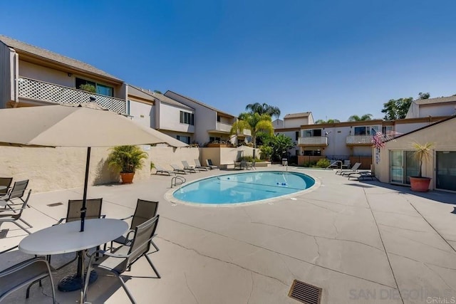 view of swimming pool with a patio