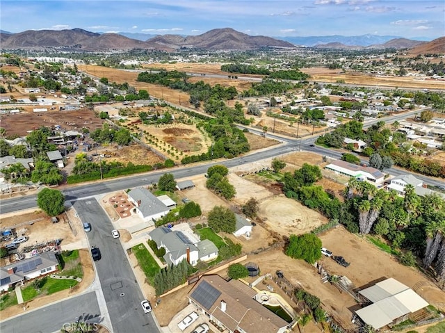 birds eye view of property with a mountain view