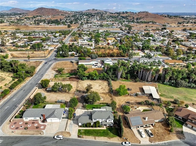 birds eye view of property with a mountain view