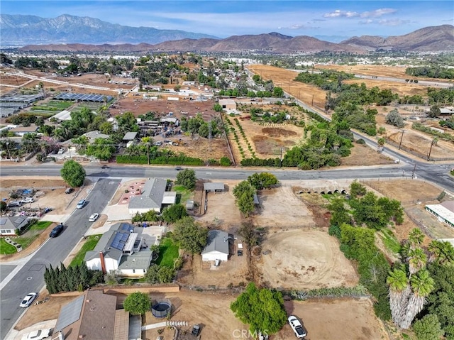 birds eye view of property with a mountain view