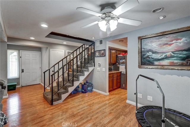 interior space with light hardwood / wood-style floors and ceiling fan