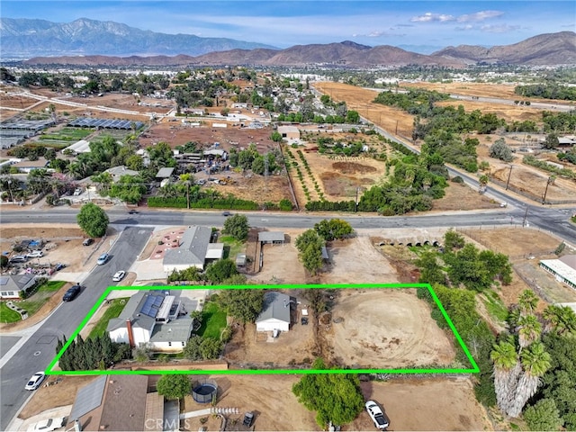 birds eye view of property featuring a mountain view