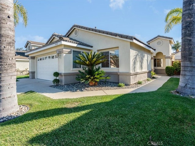 view of side of property with a yard and a garage