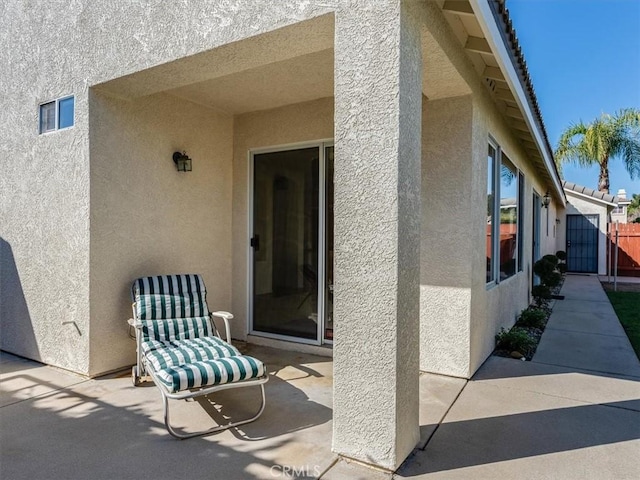 property entrance featuring a patio