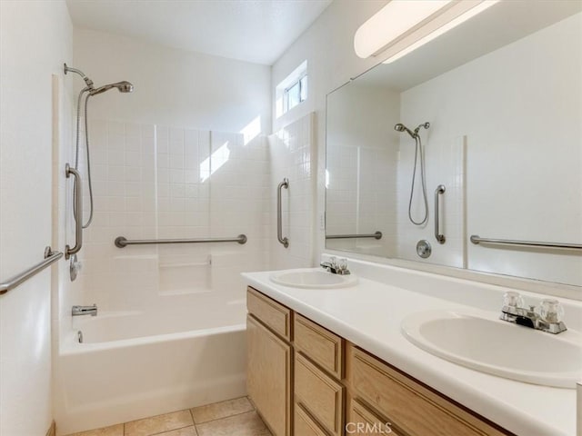 bathroom featuring tile patterned floors, vanity, and tiled shower / bath