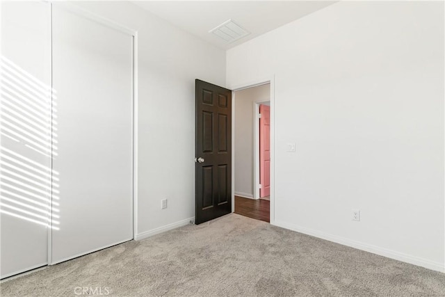 unfurnished room with light carpet