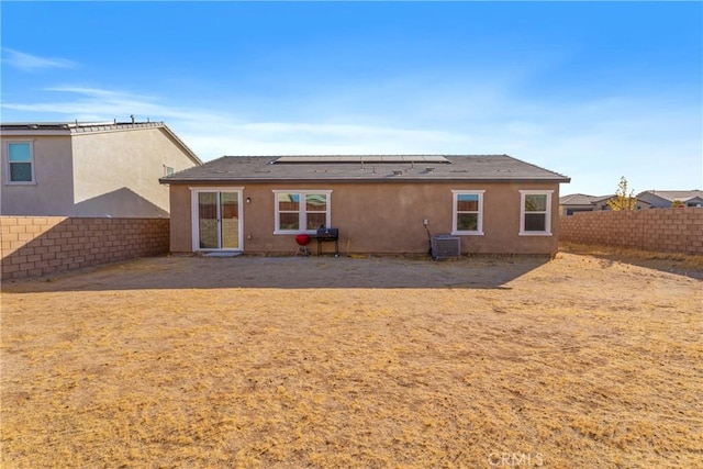 back of property featuring cooling unit