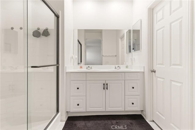 bathroom with vanity and an enclosed shower