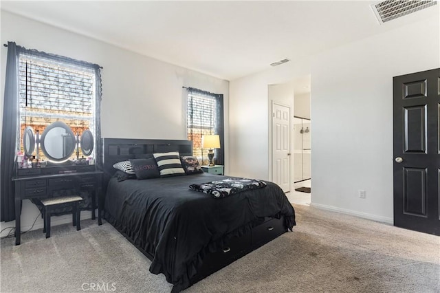 bedroom featuring light carpet and multiple windows