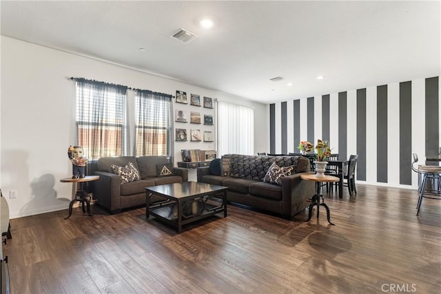 living room with dark hardwood / wood-style flooring