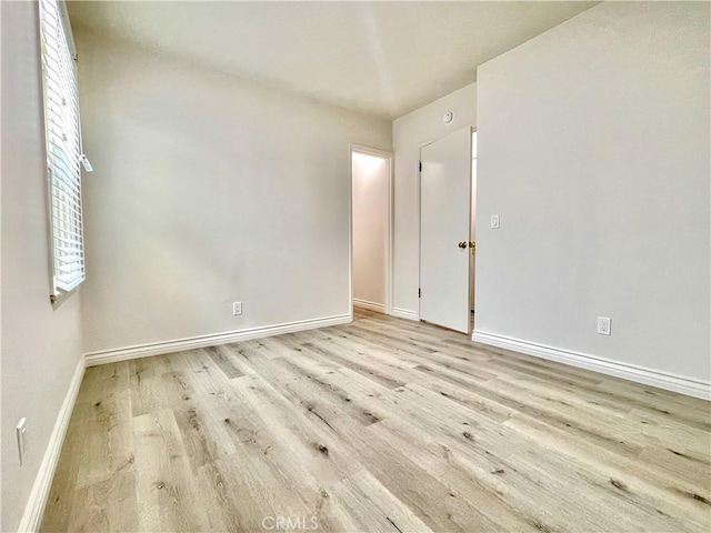 spare room with light hardwood / wood-style flooring