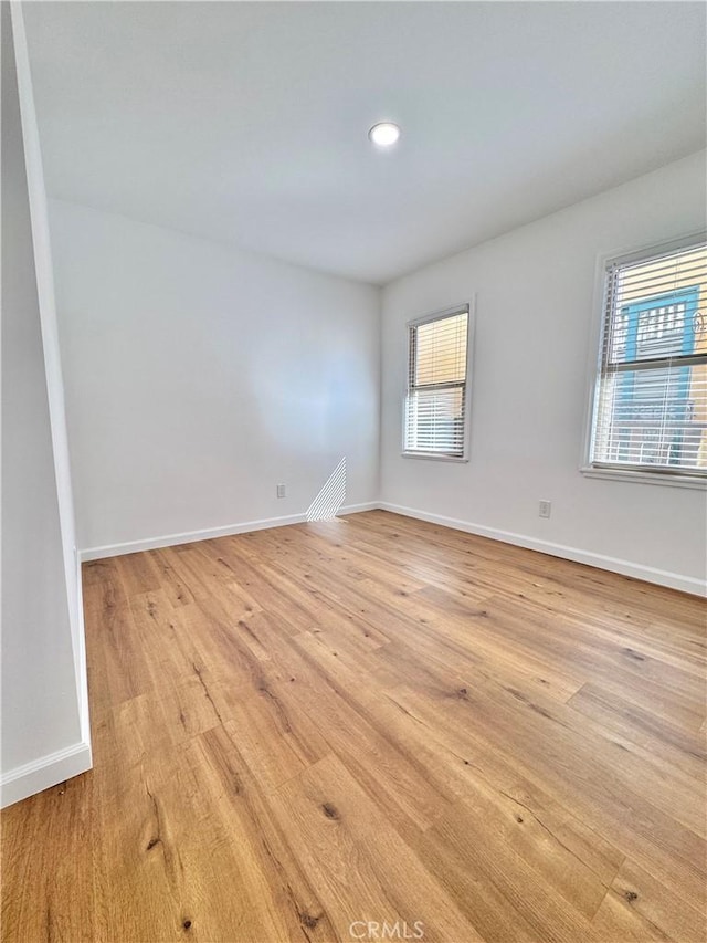 unfurnished room with plenty of natural light and light wood-type flooring