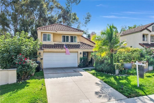 mediterranean / spanish house featuring a front lawn and a garage