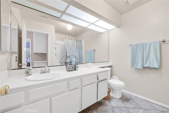 bathroom featuring a shower with curtain, tile patterned flooring, vanity, and toilet