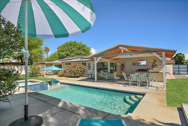 view of swimming pool featuring an in ground hot tub, a patio area, and exterior bar