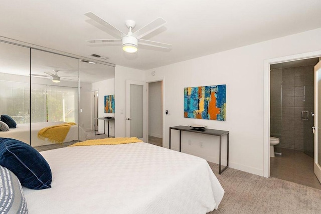 bedroom with a closet, ceiling fan, and connected bathroom