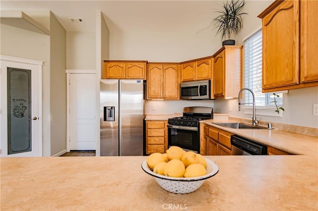 kitchen featuring stainless steel appliances and sink