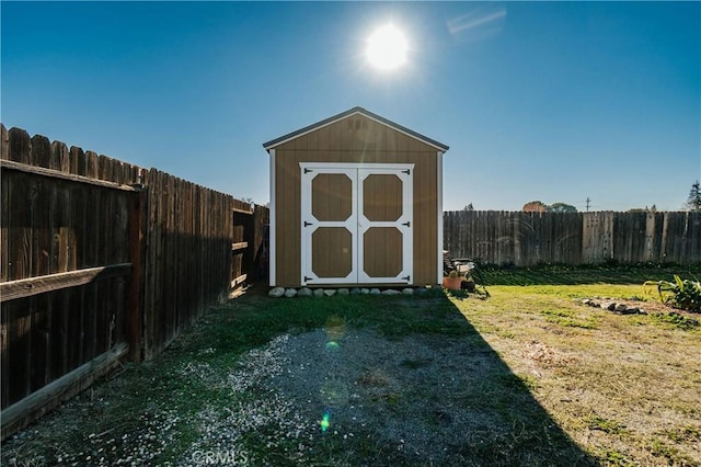 view of outbuilding with a yard