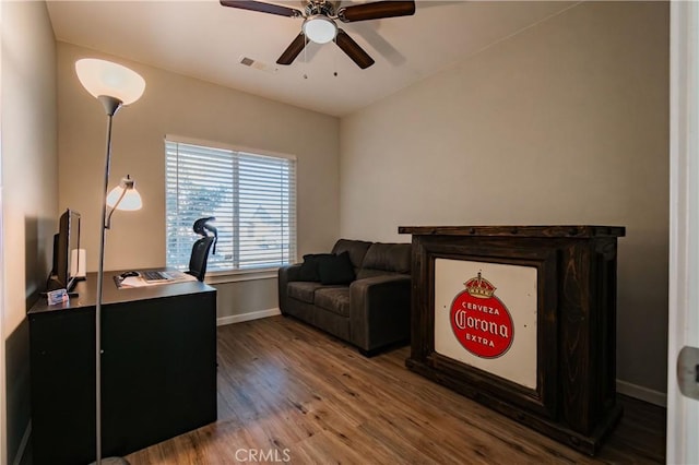 office featuring hardwood / wood-style flooring and ceiling fan