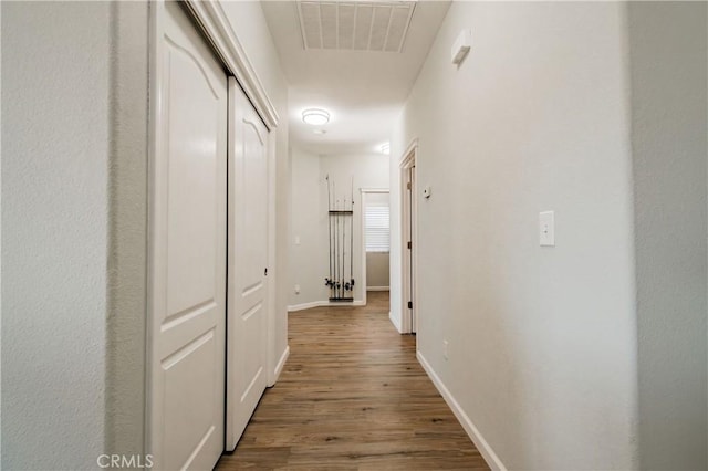 hall with hardwood / wood-style flooring