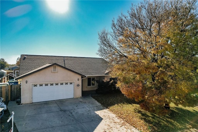 ranch-style house featuring a garage