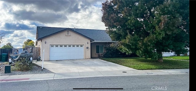 single story home featuring a front yard and a garage