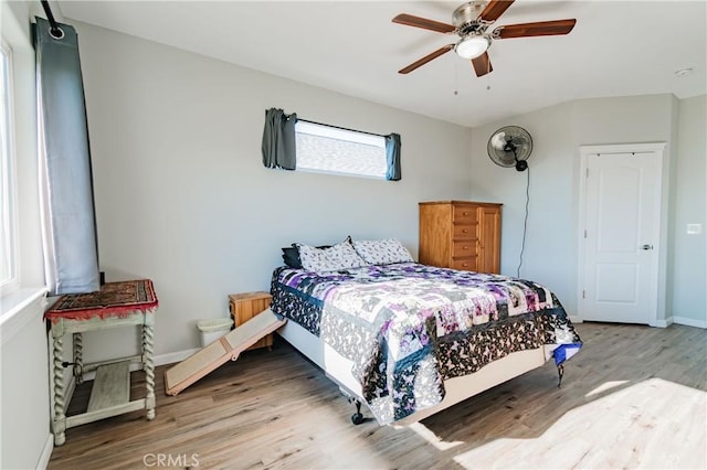 bedroom featuring wood-type flooring and ceiling fan