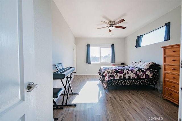 bedroom with ceiling fan and wood-type flooring