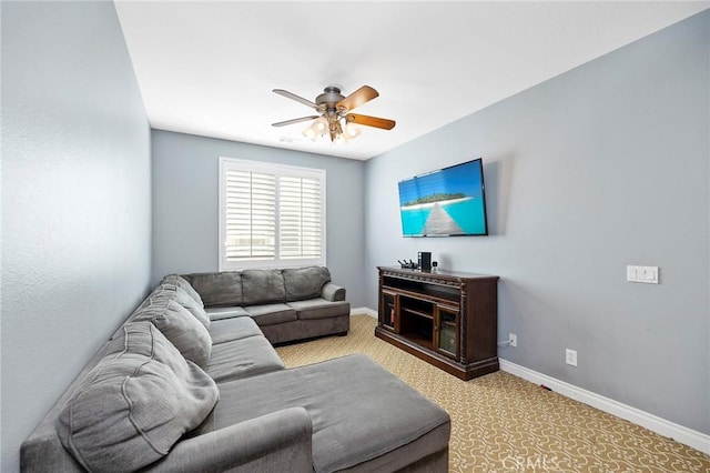 carpeted living room featuring ceiling fan