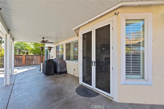 view of patio with ceiling fan and area for grilling