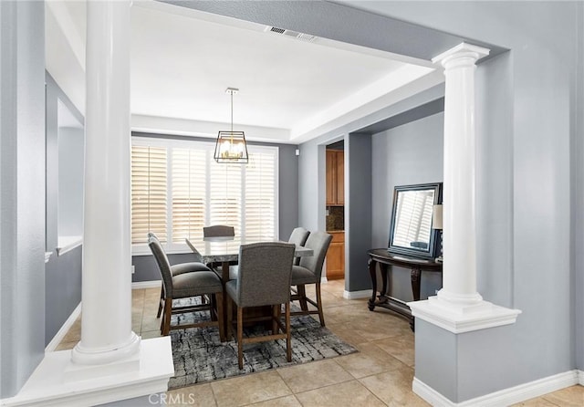 dining room with decorative columns and light tile patterned floors