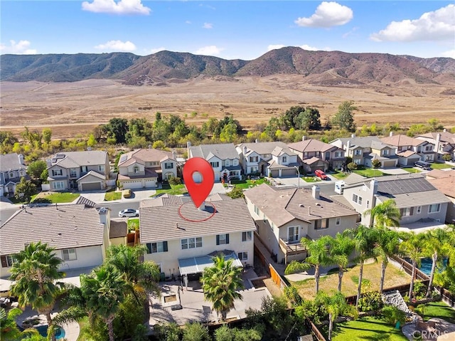 birds eye view of property with a mountain view