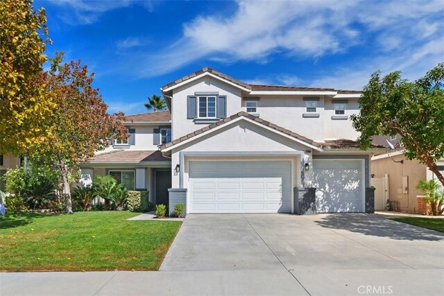 view of front property featuring a front yard and a garage