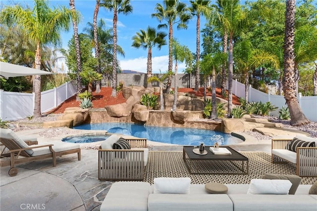 view of pool with an in ground hot tub, an outdoor hangout area, and a patio