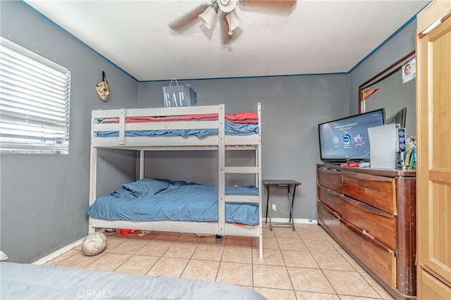 tiled bedroom with ceiling fan