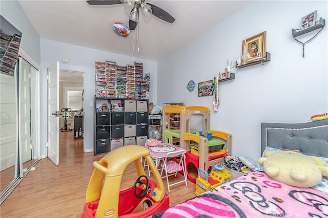 recreation room with hardwood / wood-style flooring and ceiling fan