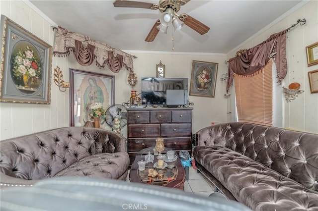 living room with tile patterned flooring, ceiling fan, and crown molding