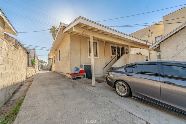 view of home's exterior with a carport