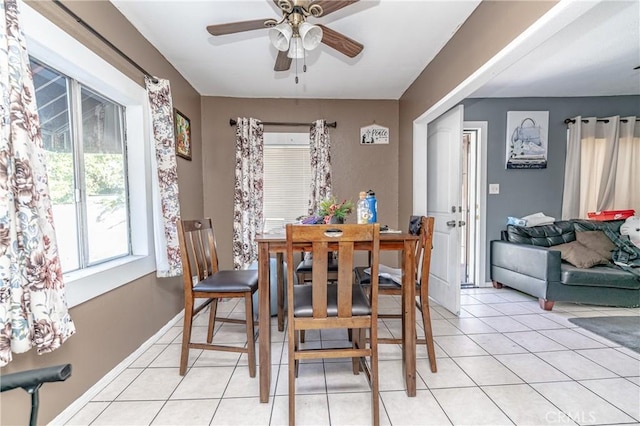 dining area with ceiling fan and light tile patterned floors